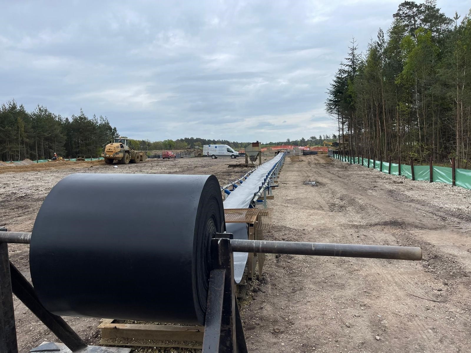 Coiled conveyor belt roll at a quarry