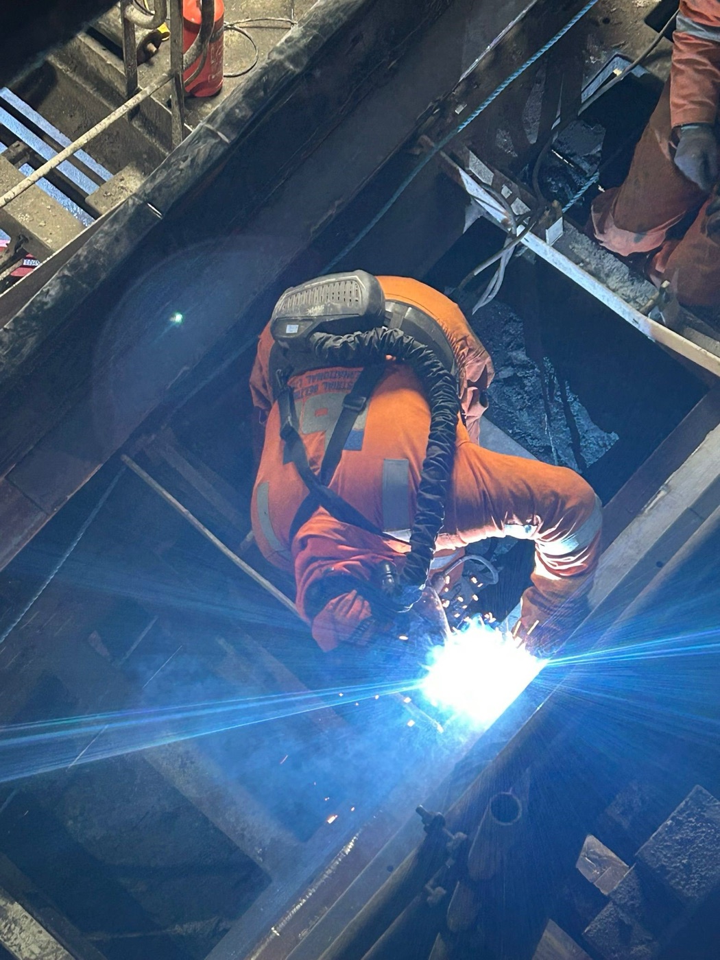 IBI engineer welding and fabricating conveyor equipment on site