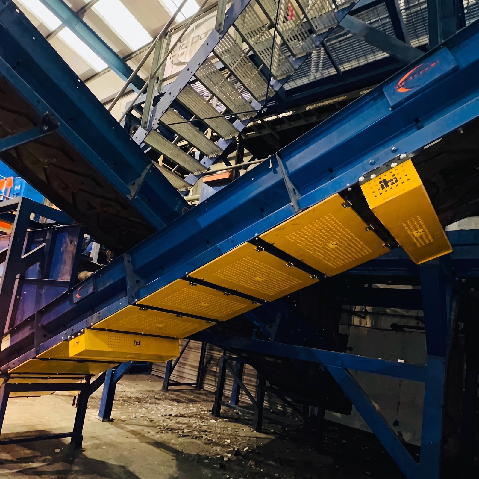 Bespoke fabricated conveyor with IBI yellow safety guarding and inspection walkways