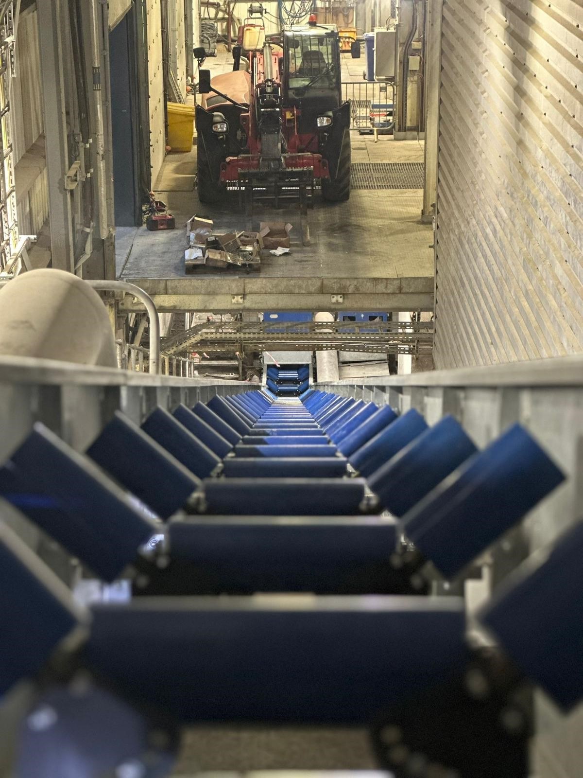 Newly installed conveyor with blue troughing roller sets